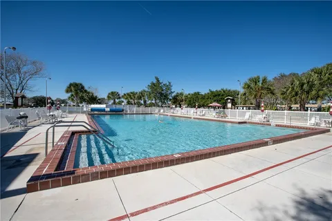 a view of swimming pool with a yard