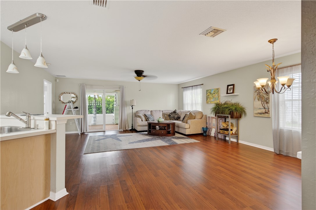 14339 Amapola Circle Fort Pierce, FL 34951 - Photo 10 of 36 a living room with furniture and a chandelier