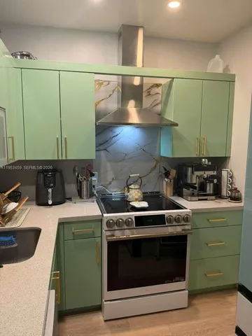 a kitchen with a stove and a sink