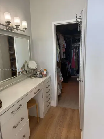 a bedroom with a bed and a mirror