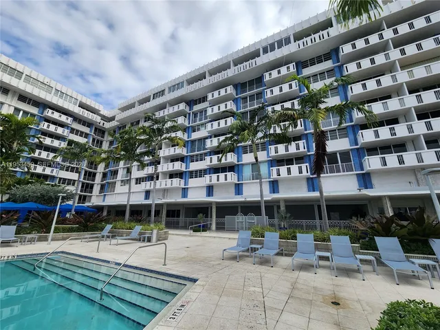 a view of a building with sitting area