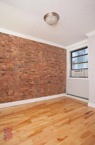 a bathroom with a bathtub shower sink mirror and toilet