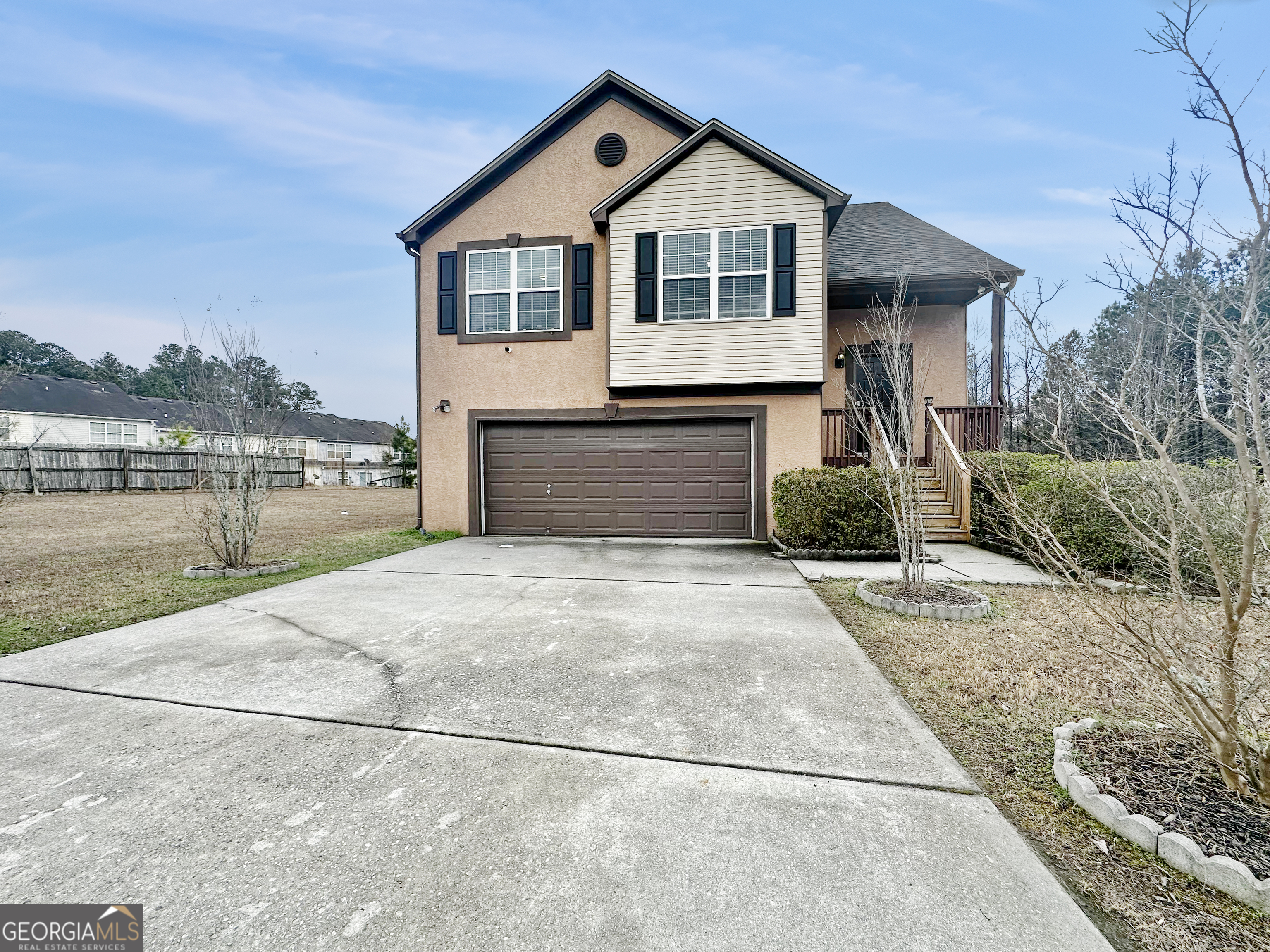 a front view of a house with a yard