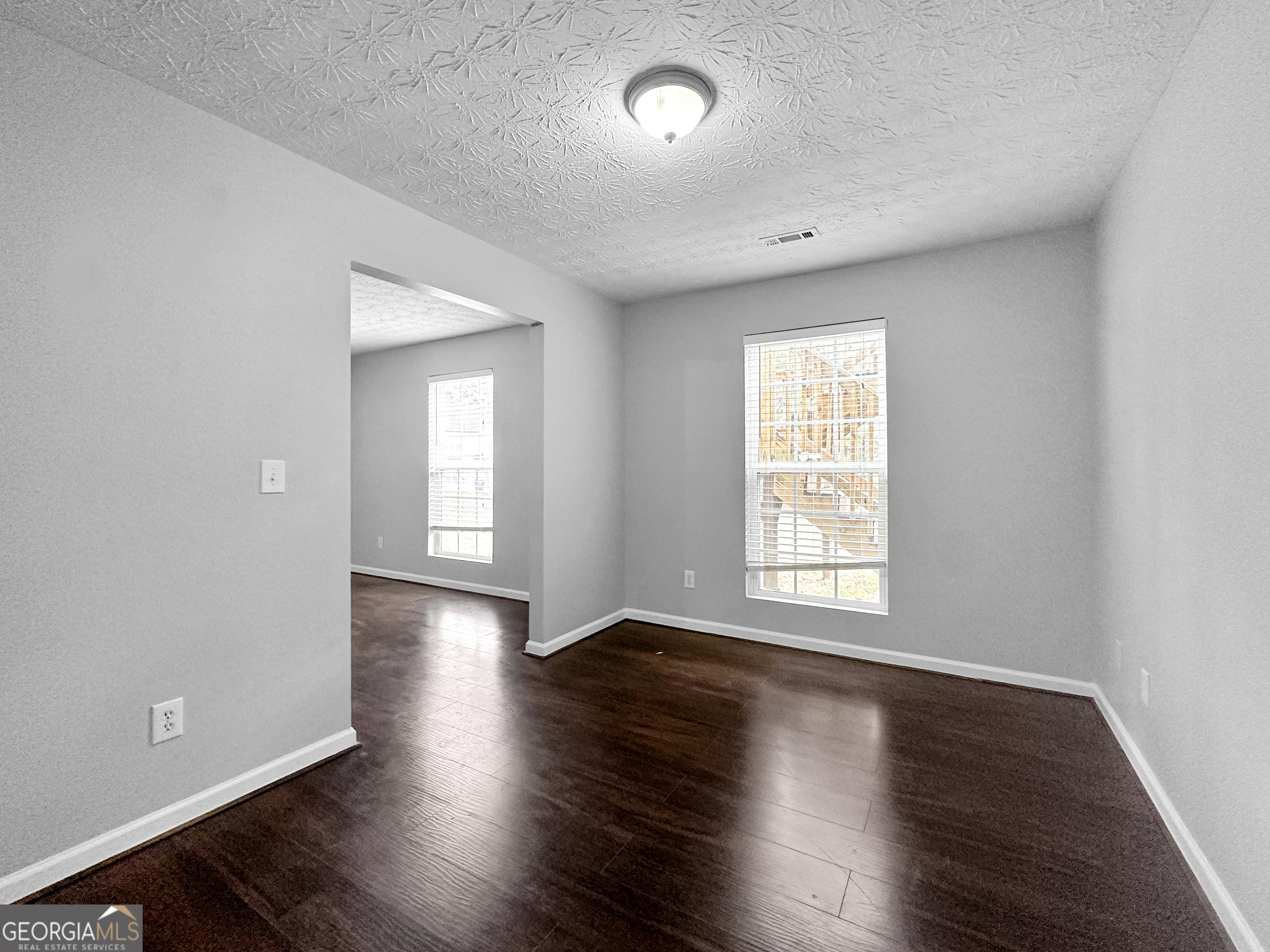 105 Aprils Way Union City, GA 30291 - Photo 11 of 20 an empty room with wooden floor and windows