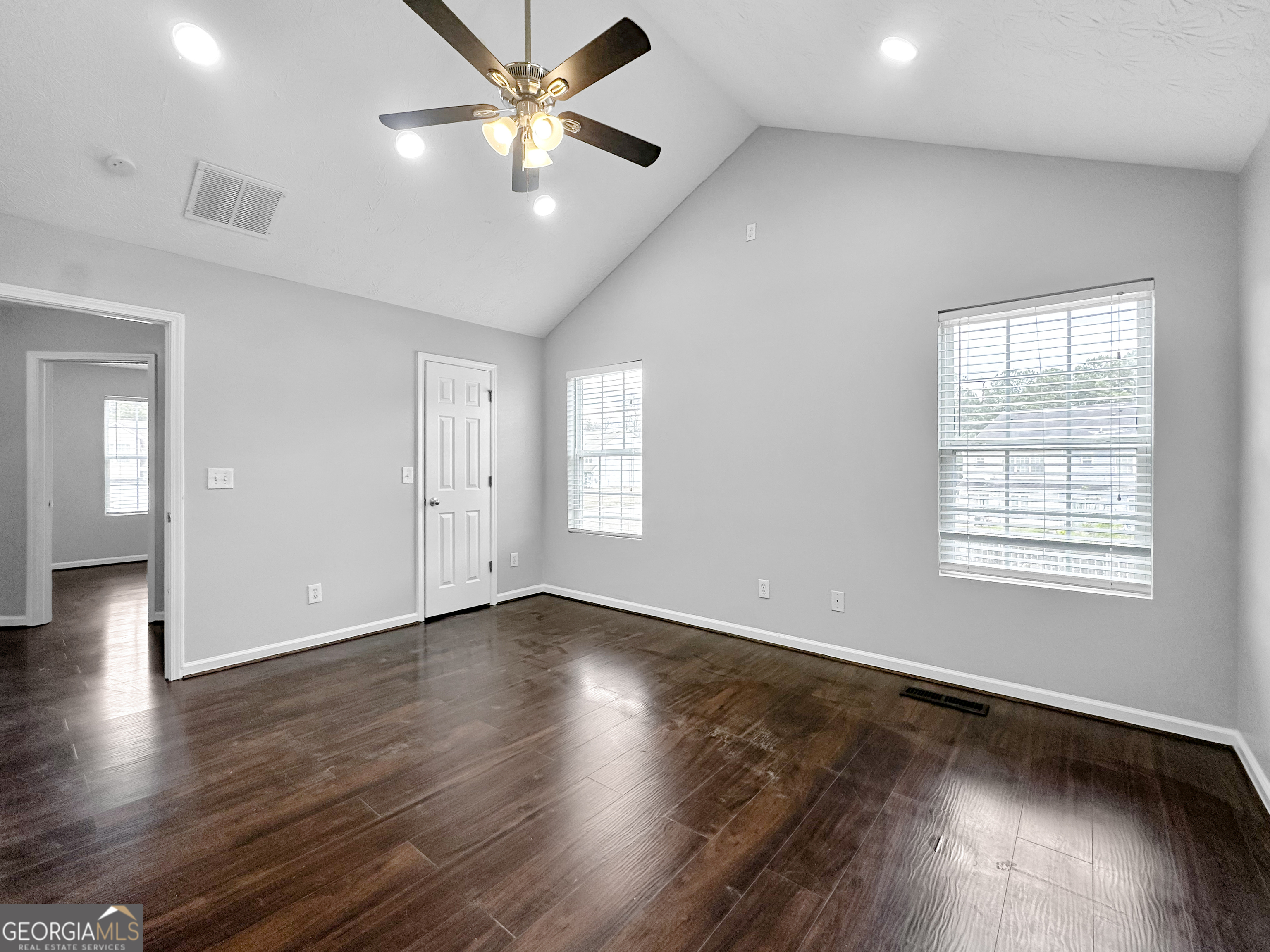 105 Aprils Way Union City, GA 30291 - Photo 12 of 20 a view of an empty room with wooden floor and a window