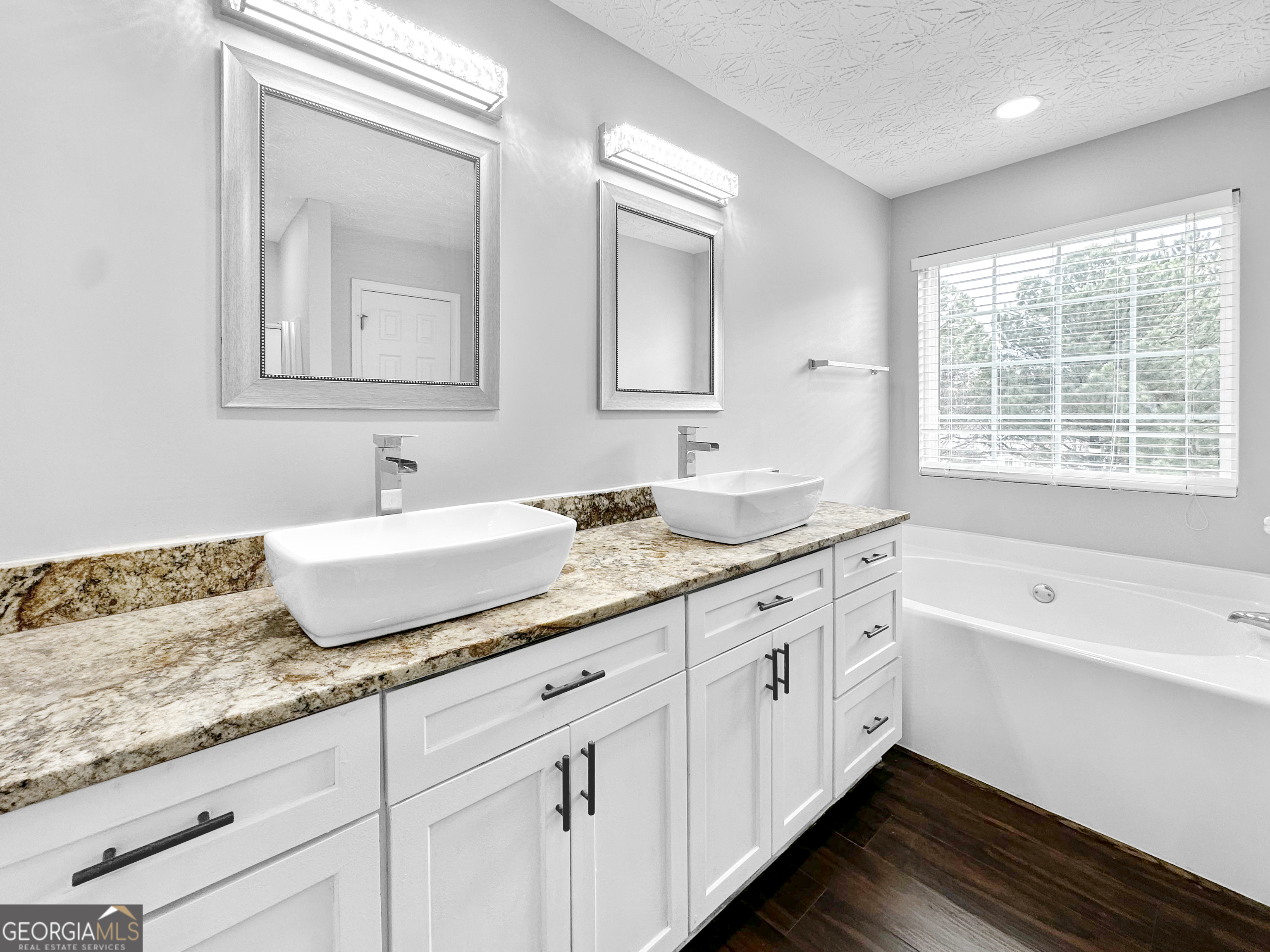 105 Aprils Way Union City, GA 30291 - Photo 13 of 20 a bathroom with a granite countertop sink mirror and
