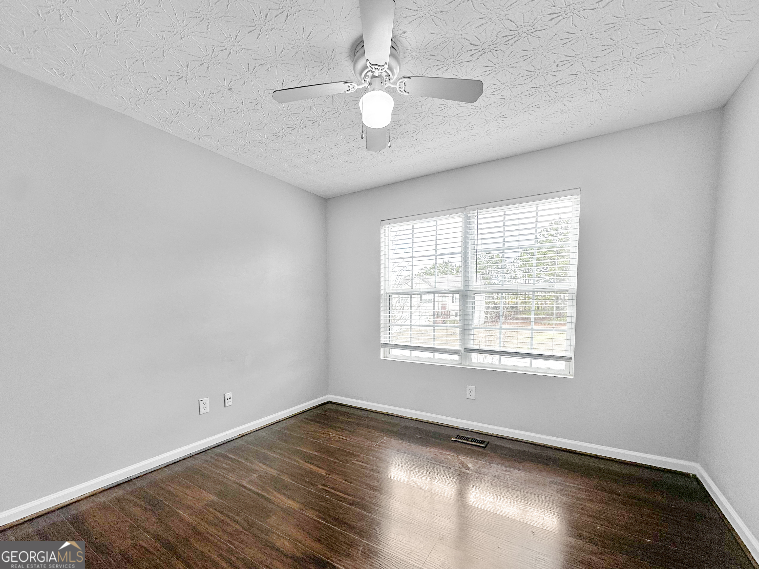 105 Aprils Way Union City, GA 30291 - Photo 14 of 20 an empty room with wooden floor and windows