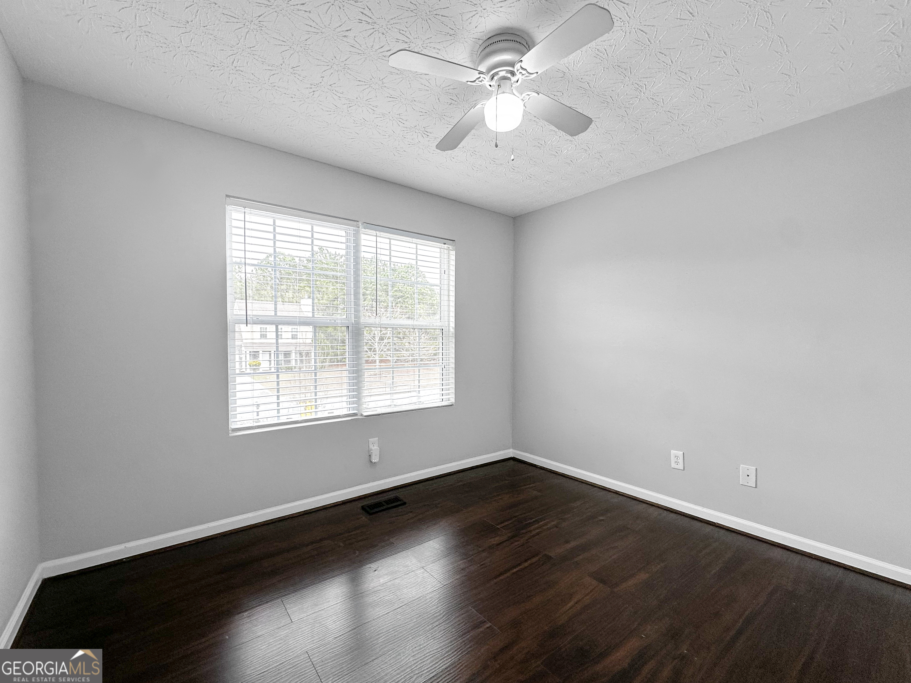 105 Aprils Way Union City, GA 30291 - Photo 15 of 20 an empty room with wooden floor and windows