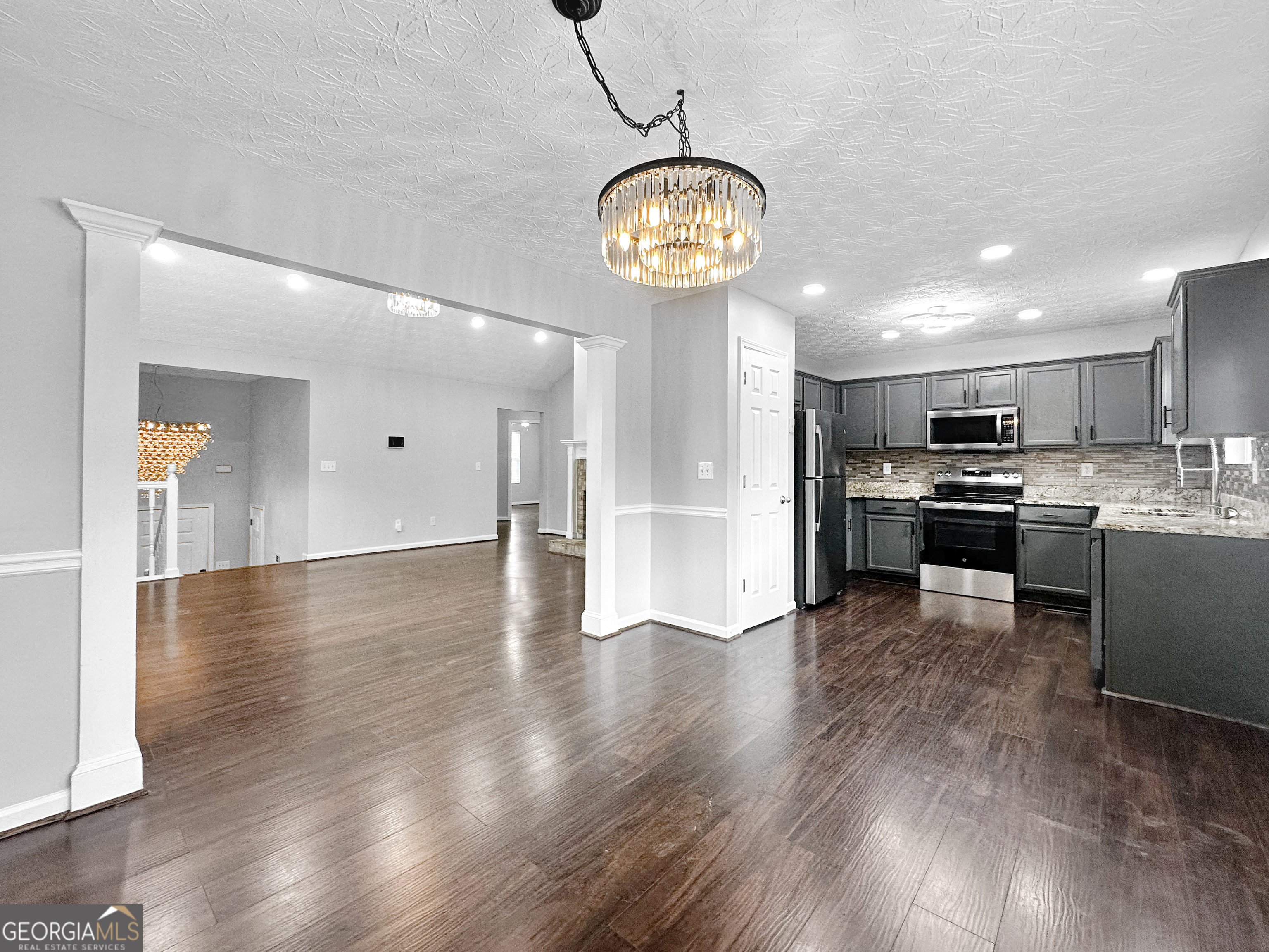 105 Aprils Way Union City, GA 30291 - Photo 6 of 20 a view of a kitchen with a sink stainless steel appliances and cabinets