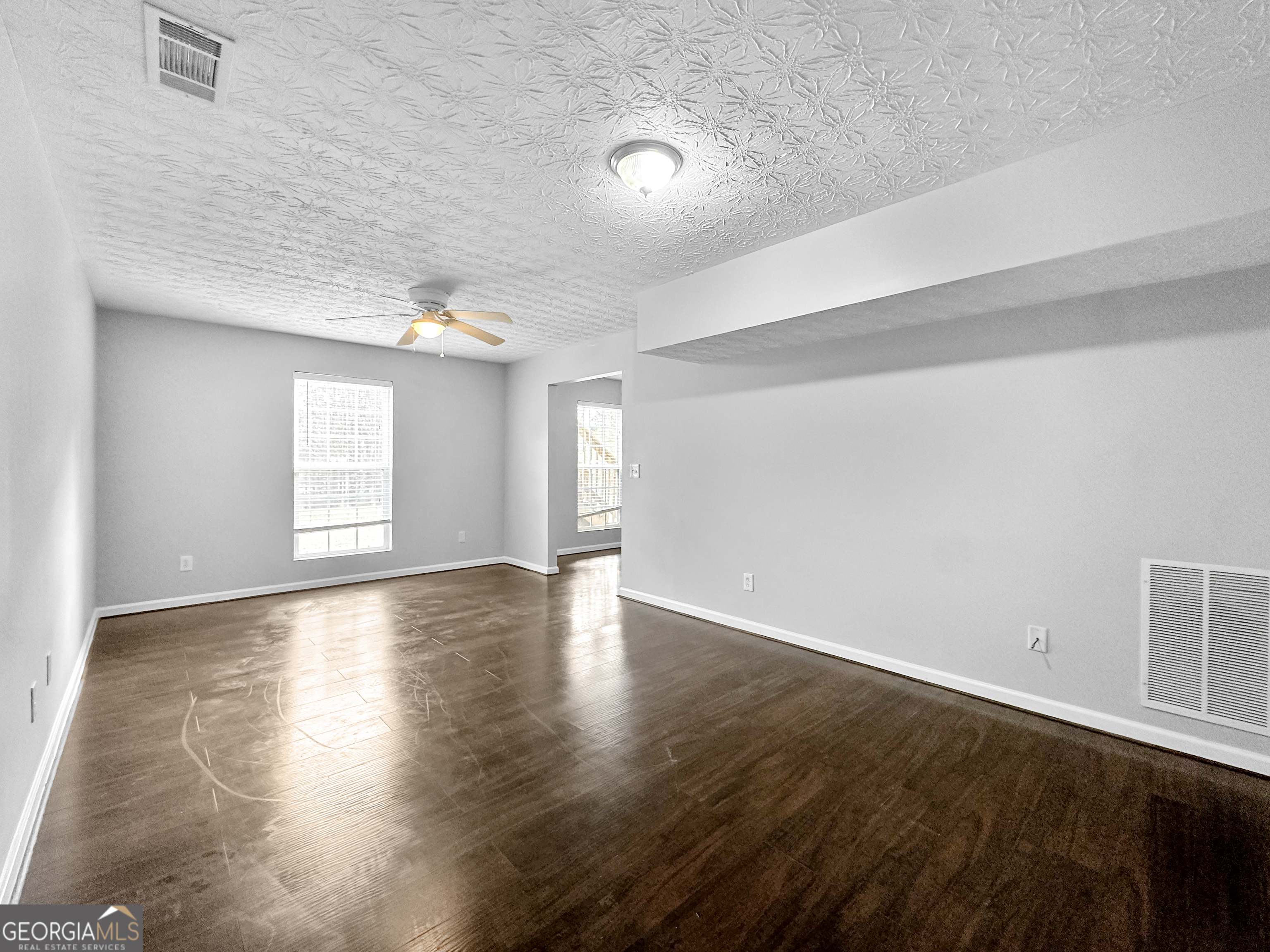105 Aprils Way Union City, GA 30291 - Photo 10 of 20 wooden floor in an empty room with a window
