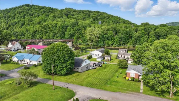 a backyard of a house with lots of green space