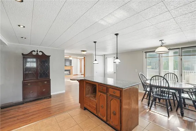 a open kitchen with stainless steel appliances granite countertop a sink and cabinets