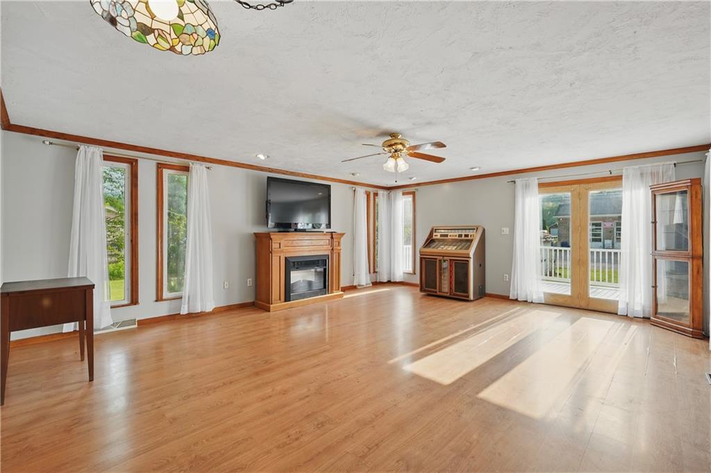 833 Oden Street Confluence, PA 15424 - Photo 30 of 48 a view of a livingroom with furniture wooden floor staircase and windows