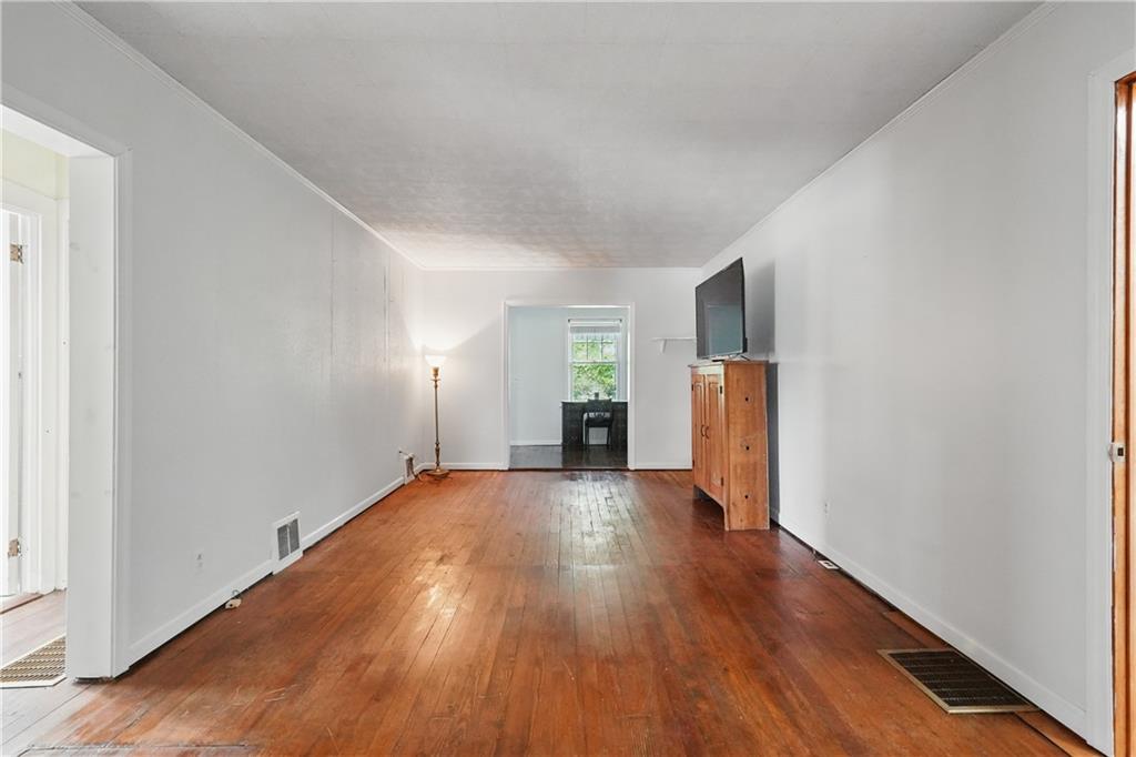 833 Oden Street Confluence, PA 15424 - Photo 36 of 48 a view of a big room with wooden floor and windows