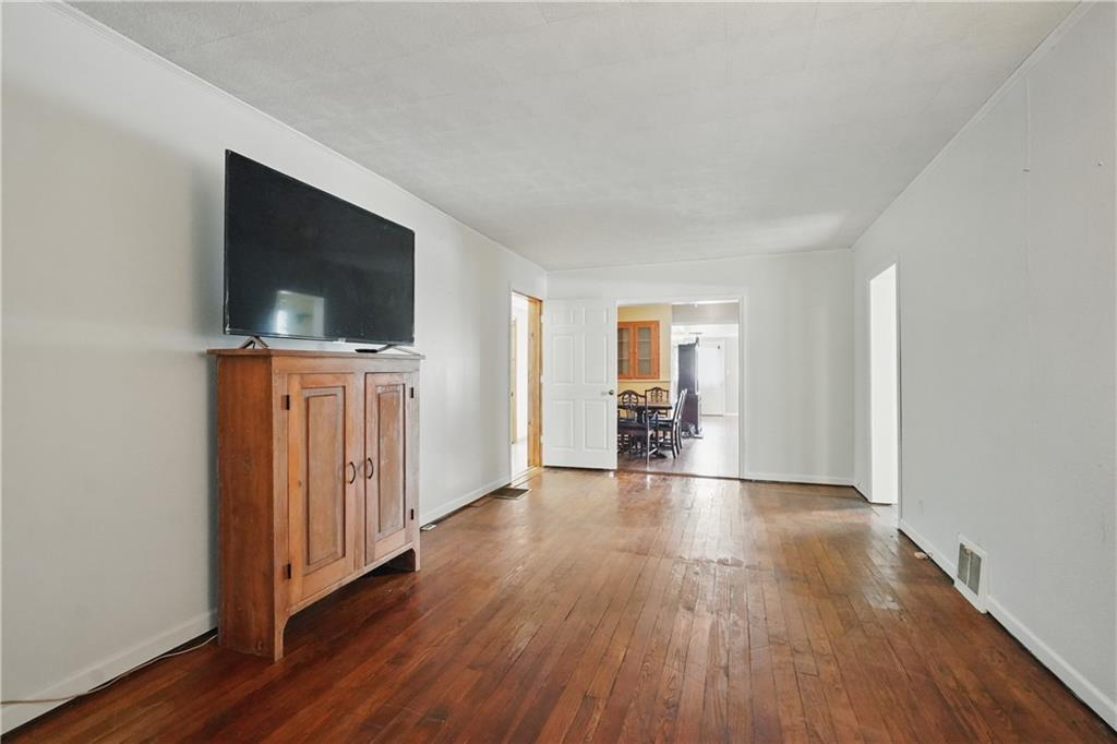 833 Oden Street Confluence, PA 15424 - Photo 37 of 48 a view of a livingroom with wooden floor and a flat screen tv