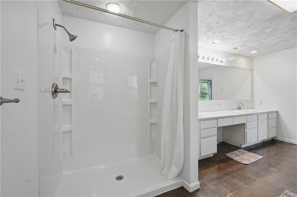 833 Oden Street Confluence, PA 15424 - Photo 44 of 48 a bathroom with a mirror a shower and a sink