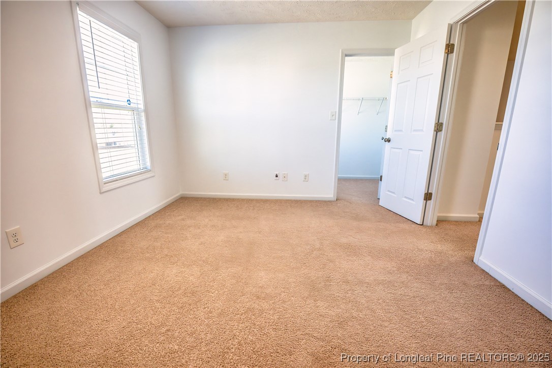 2112 Yellowbrick Road Fayetteville, NC 28314 - Photo 31 of 48 an empty room with windows