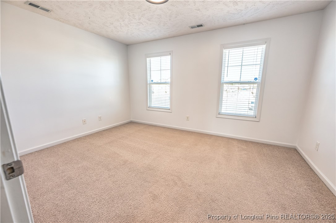2112 Yellowbrick Road Fayetteville, NC 28314 - Photo 33 of 48 an empty room with windows