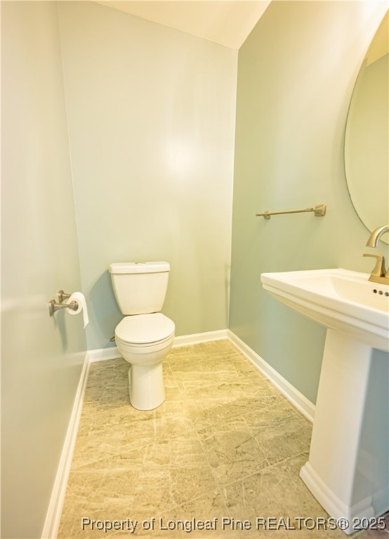 2112 Yellowbrick Road Fayetteville, NC 28314 - Photo 6 of 48 a bathroom with a sink and a toilet