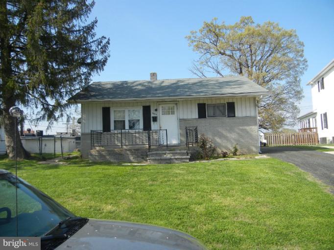 1832 Kitty Hawk Road Essex, MD 21221 - Photo 2 of 2 a front view of house with yard and green space