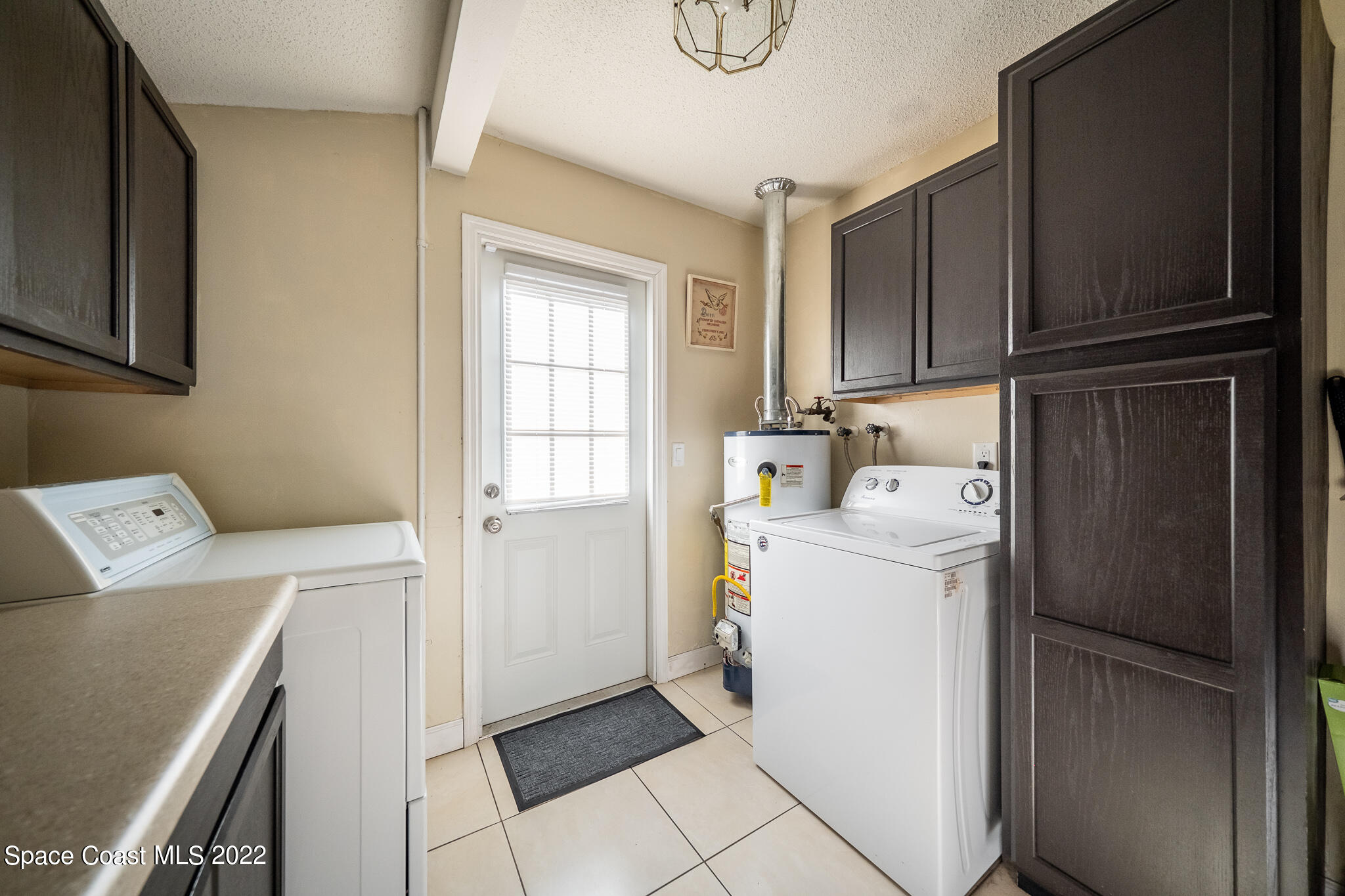 982 Cardon Drive Rockledge, FL 32955 - Photo 17 of 27 a utility room with dryer and washer