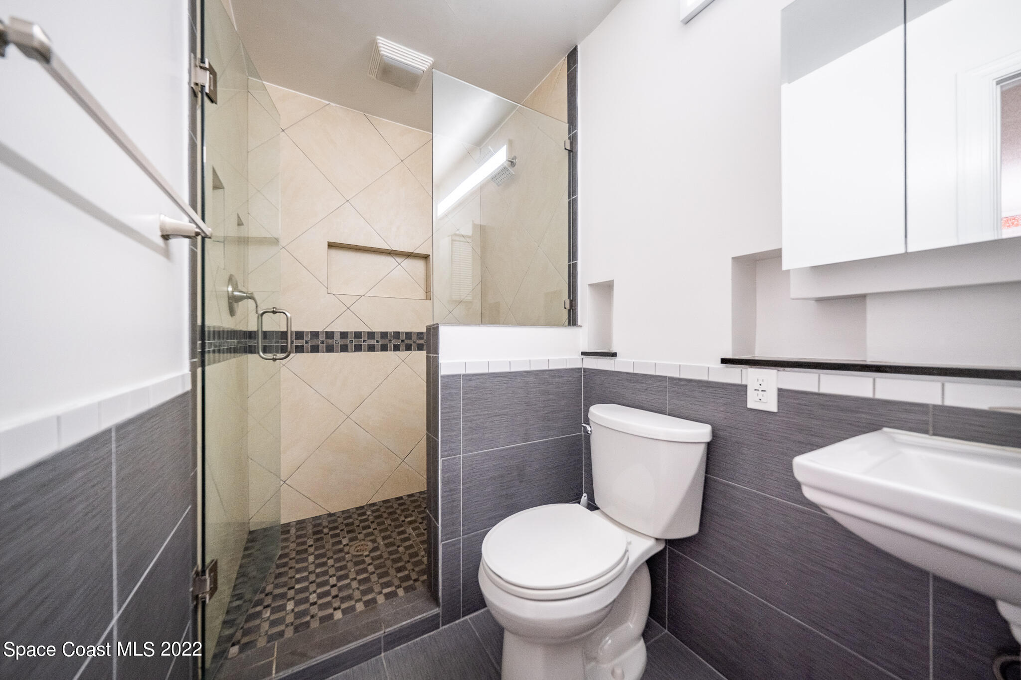 982 Cardon Drive Rockledge, FL 32955 - Photo 22 of 27 a bathroom with a toilet and a sink