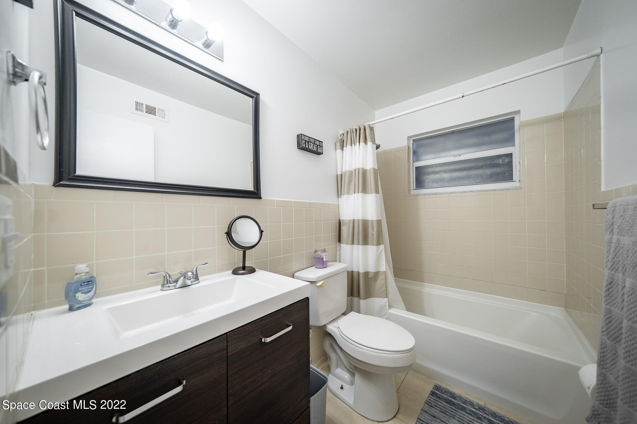 982 Cardon Drive Rockledge, FL 32955 - Photo 25 of 27 a bathroom with a bathtub shower sink mirror and toilet