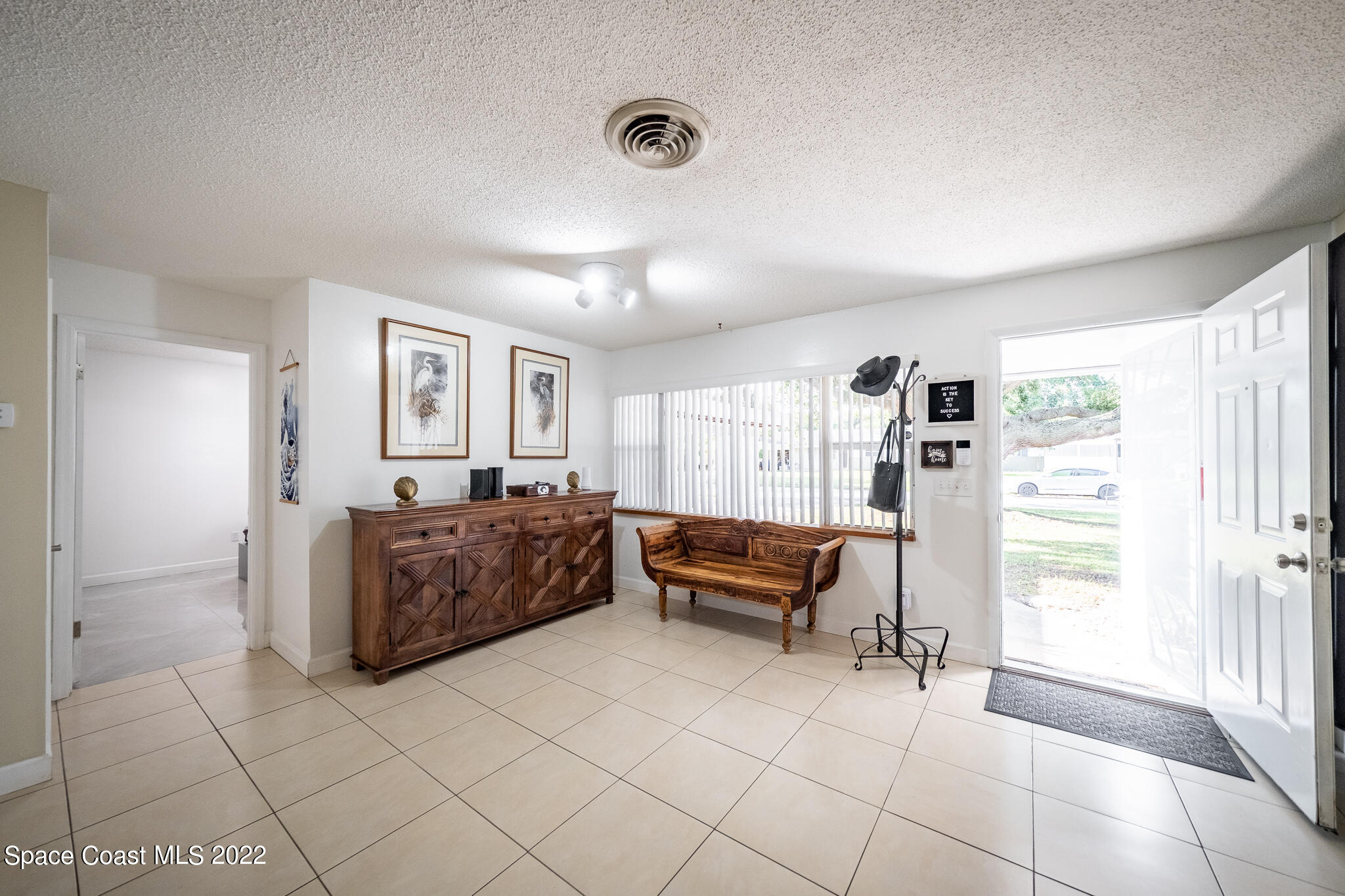 982 Cardon Drive Rockledge, FL 32955 - Photo 8 of 27 a living room with furniture and a window