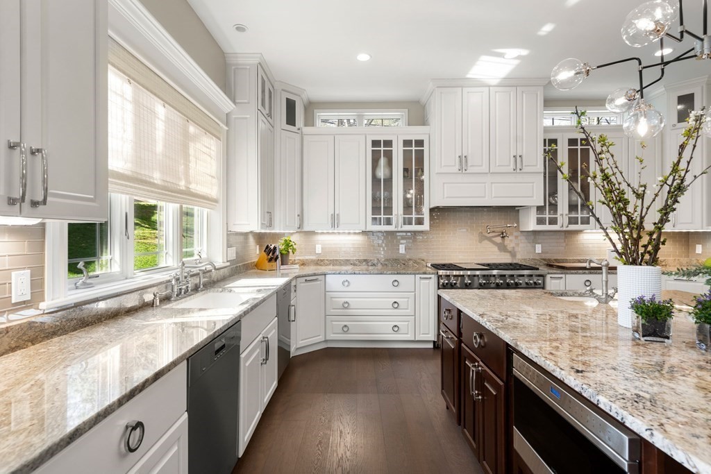 9 Nardell Road Newton, MA 02459 - Photo 3 of 32 a large kitchen with stainless steel appliances granite countertop a stove a sink and a granite counter tops with white cabinets
