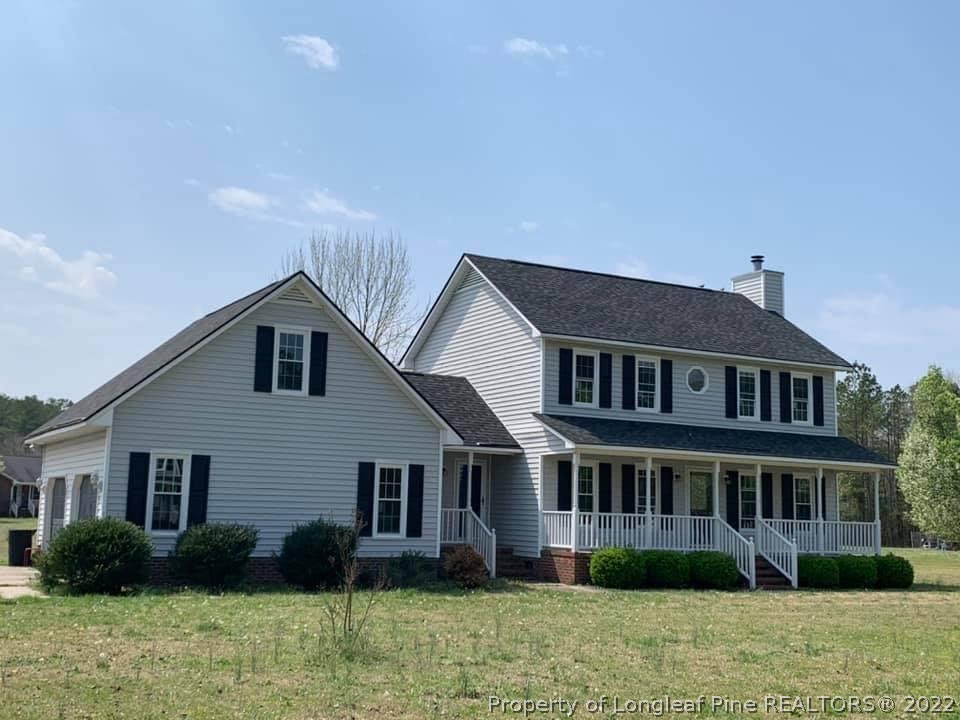 4520 Mobius Road Fayetteville, NC 28312 - Photo 1 of 29 a front view of a house with garden and plants
