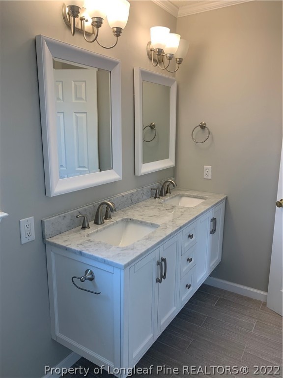 4520 Mobius Road Fayetteville, NC 28312 - Photo 20 of 29 a bathroom with a granite countertop sink a large mirror and a