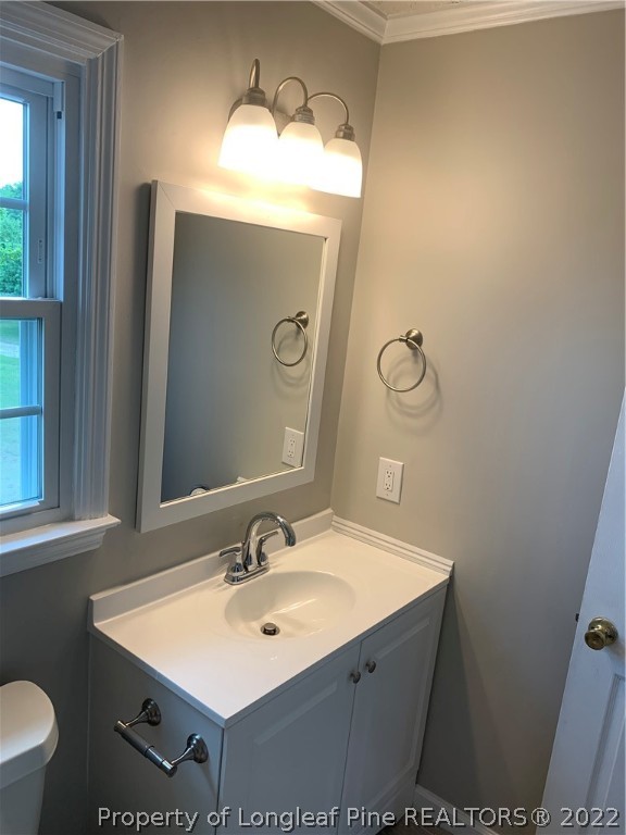 4520 Mobius Road Fayetteville, NC 28312 - Photo 23 of 29 a bathroom with a sink mirror and vanity