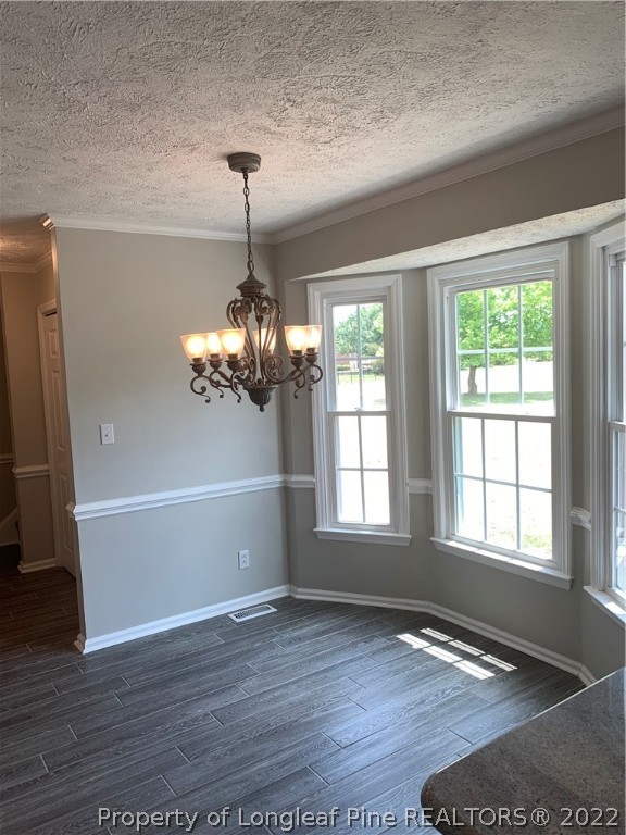 4520 Mobius Road Fayetteville, NC 28312 - Photo 5 of 29 a view of an empty room with wooden floor and a window