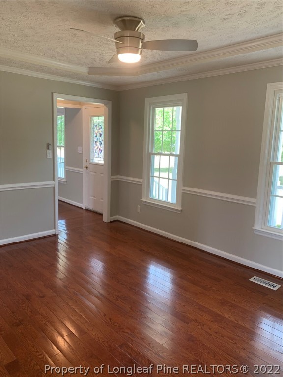 4520 Mobius Road Fayetteville, NC 28312 - Photo 6 of 29 a view of an empty room with wooden floor and a window