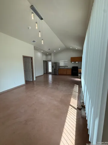 a view of a hall with stairs