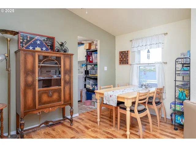a view of a dining room with furniture window and outside view