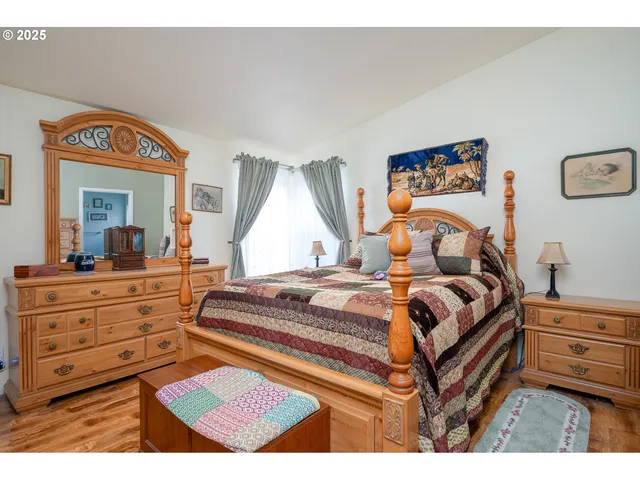 a bedroom with a bed and a dresser