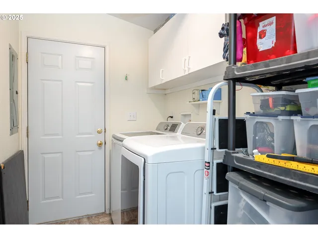 a backyard of a house with table and chairs