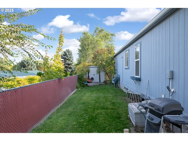 a view of house with yard