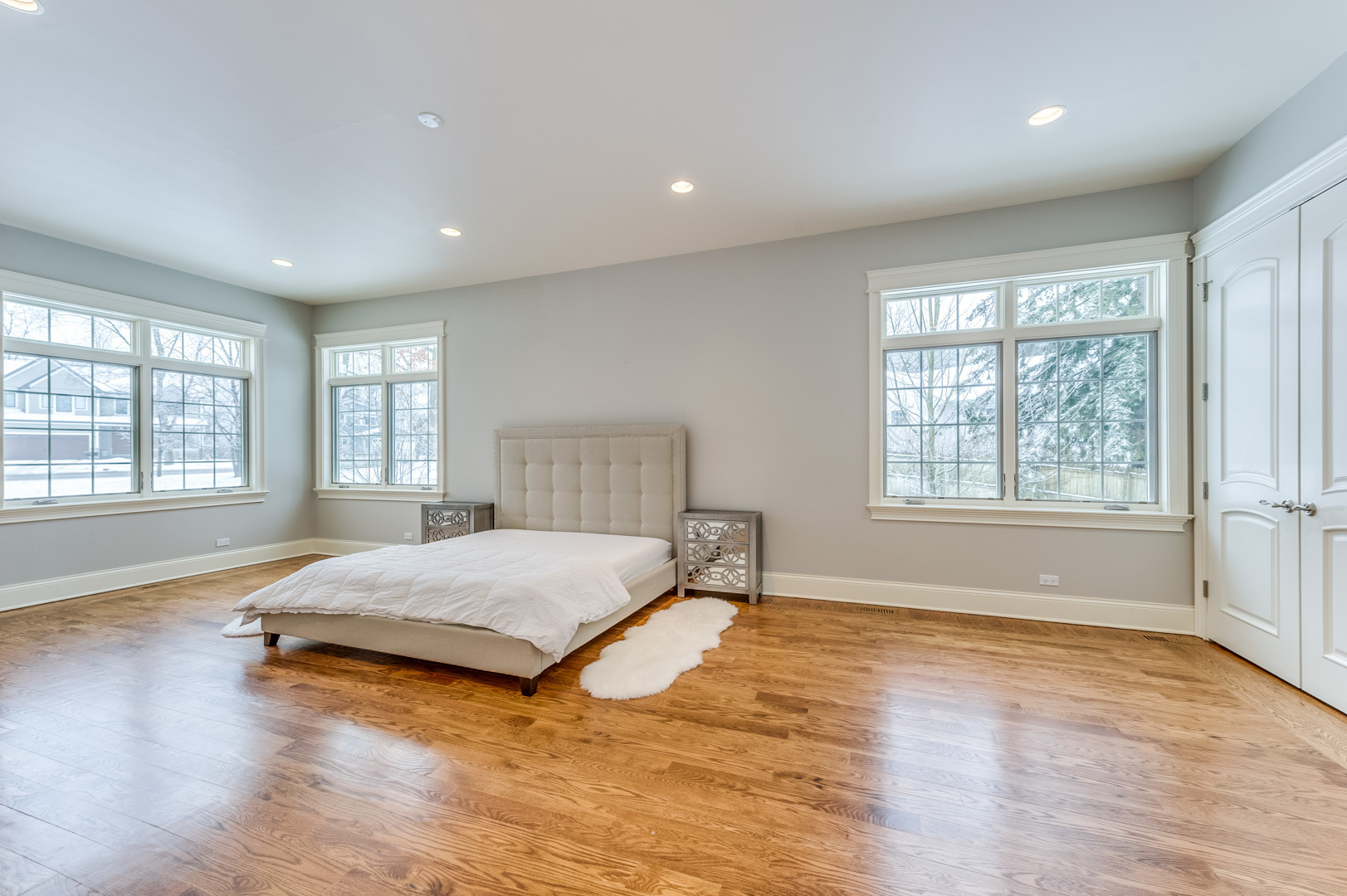 1450 Ridge Road Highland Park, IL 60035 - Photo 17 of 46 a spacious bedroom with a large bed and a large window