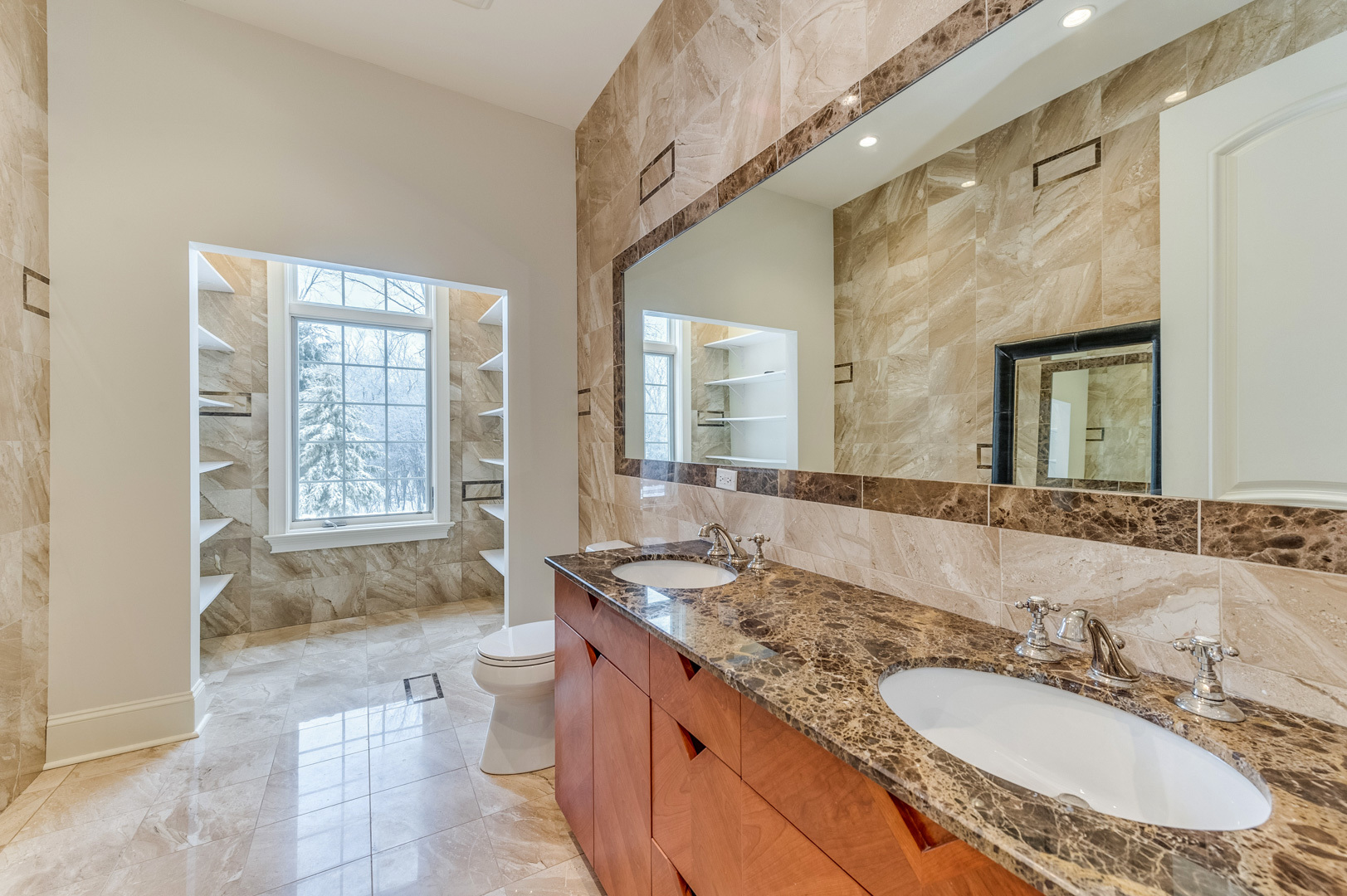 1450 Ridge Road Highland Park, IL 60035 - Photo 18 of 46 a bathroom with a granite countertop double vanity sink a mirror and a bathtub