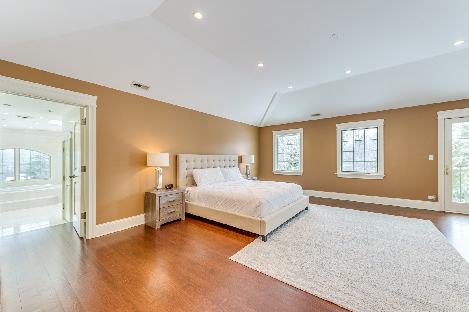 1450 Ridge Road Highland Park, IL 60035 - Photo 20 of 46 a bedroom with a large bed and wooden floor
