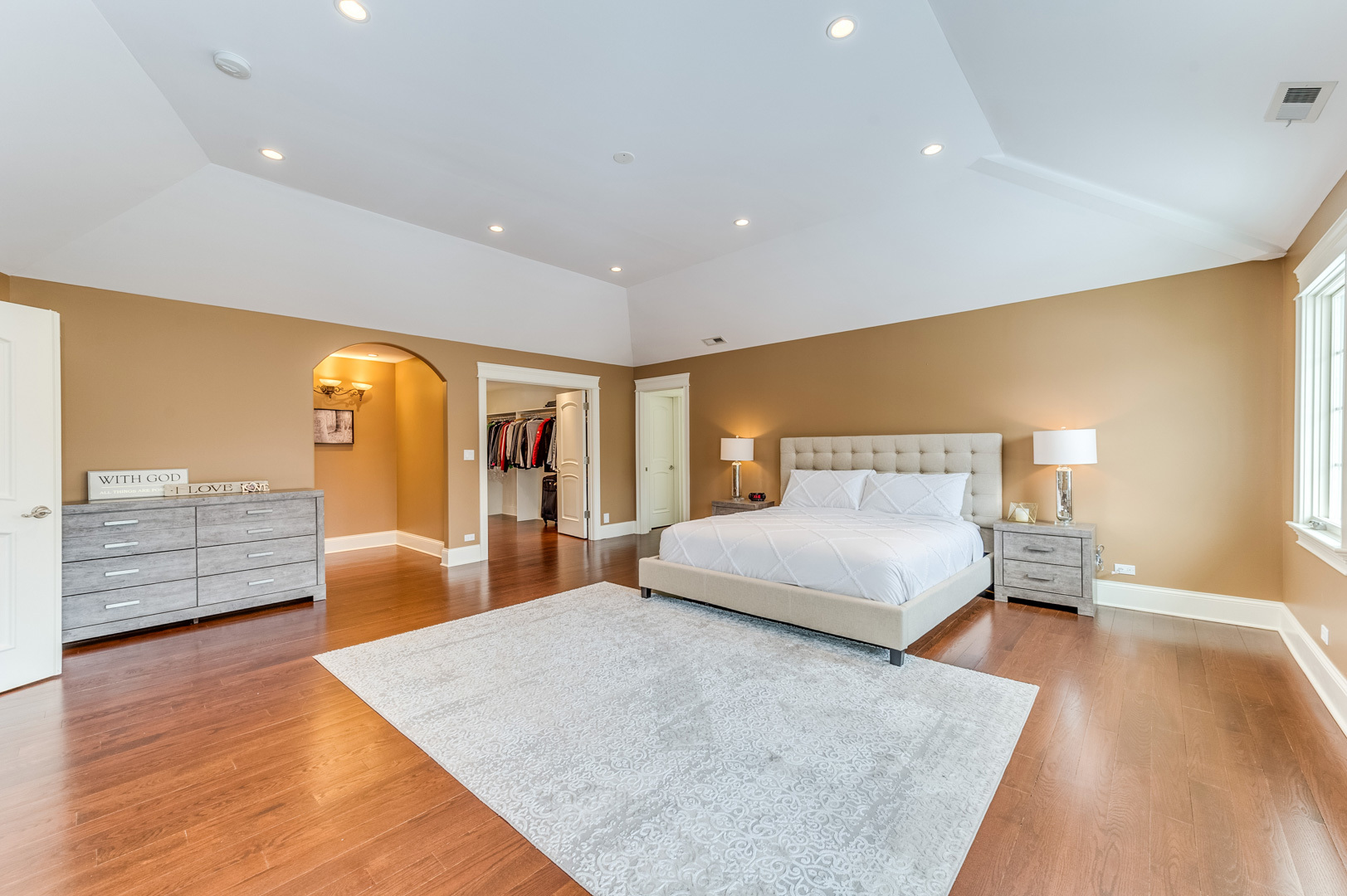 1450 Ridge Road Highland Park, IL 60035 - Photo 21 of 46 a spacious bedroom with a large bed and a wooden floor