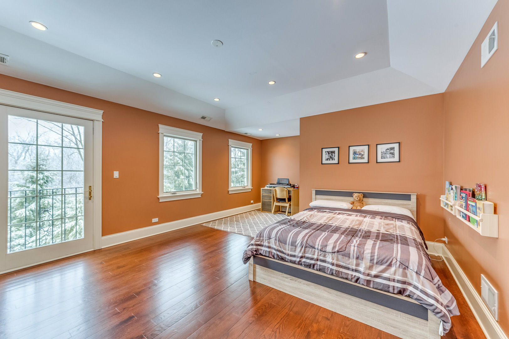 1450 Ridge Road Highland Park, IL 60035 - Photo 26 of 46 a bedroom with a bed and wooden floor