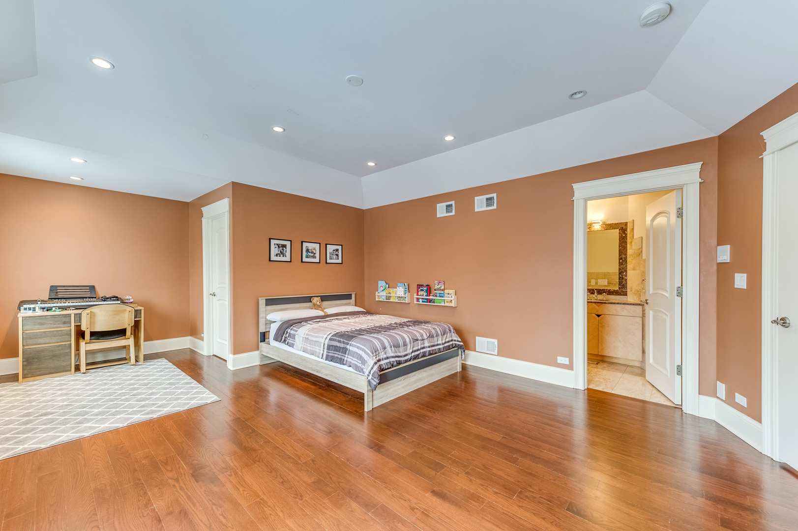 1450 Ridge Road Highland Park, IL 60035 - Photo 27 of 46 a spacious bedroom with a bed and dresser