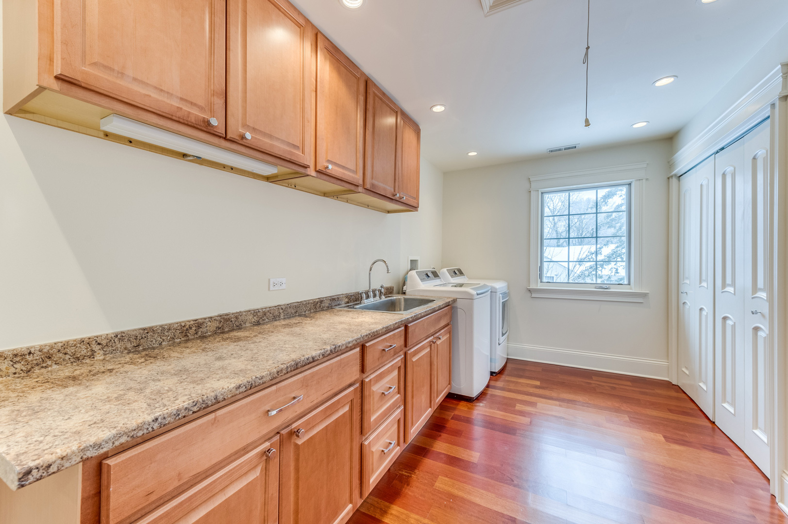 1450 Ridge Road Highland Park, IL 60035 - Photo 34 of 46 a kitchen with granite countertop cabinets stainless steel appliances a sink and a window