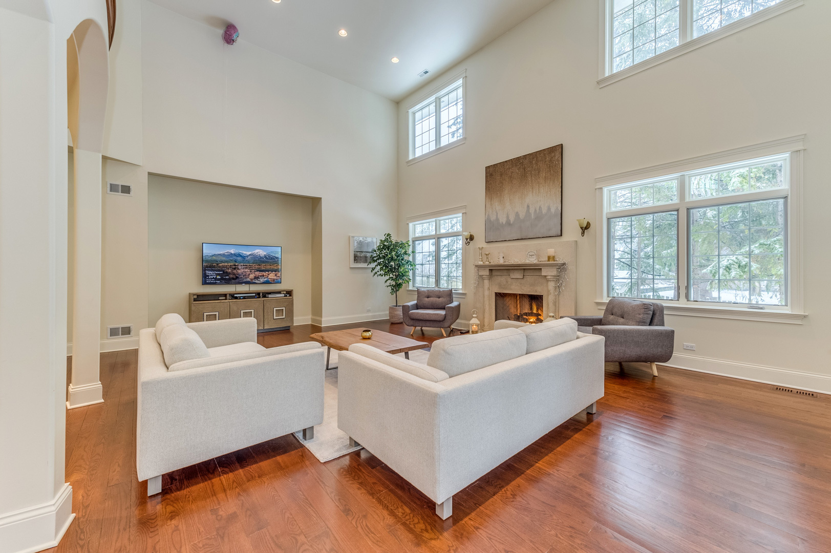 1450 Ridge Road Highland Park, IL 60035 - Photo 8 of 46 a living room with furniture a flat screen tv and a fireplace