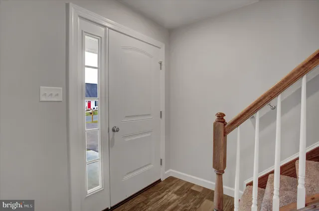 a view of entryway with wooden floor