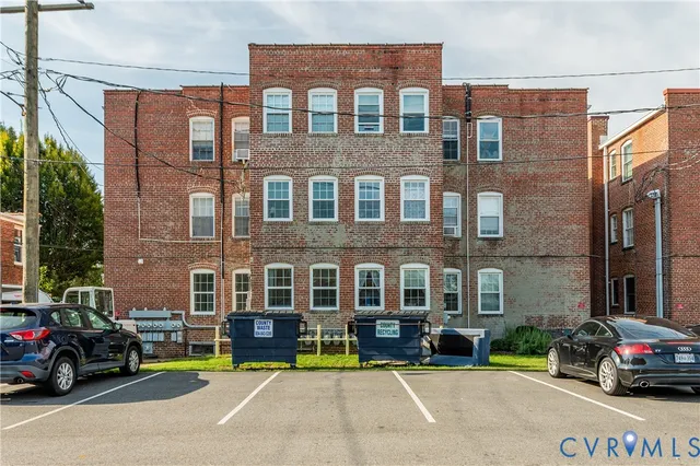 a view of a parked cars in front of a building