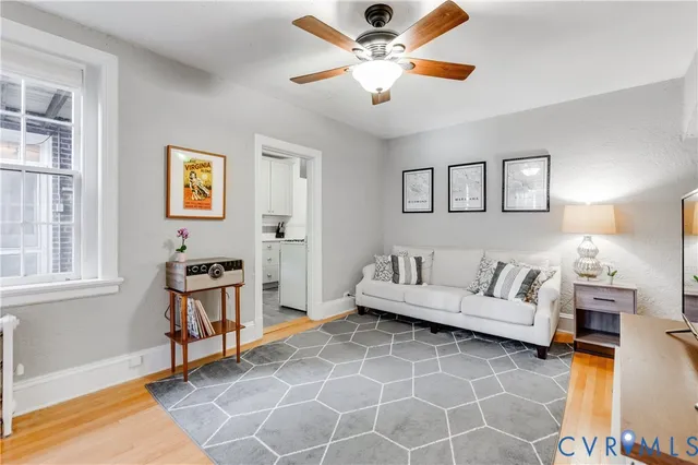 a living room with furniture and a window